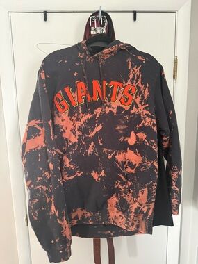 Majestic Black Hoodie with Orange Tie-Dye Accents